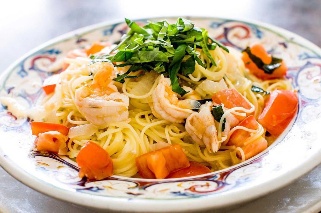 Capellini Limone · Angel hair pasta with shrimp basil, fresh chopped tomato and lemon zest in a fresh herb sauce.
