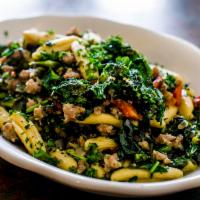 Cavatelli Rapini · Fresh short rolled pasta with sauteed broccoli rabe, roasted red peppers and sausage in a wh...