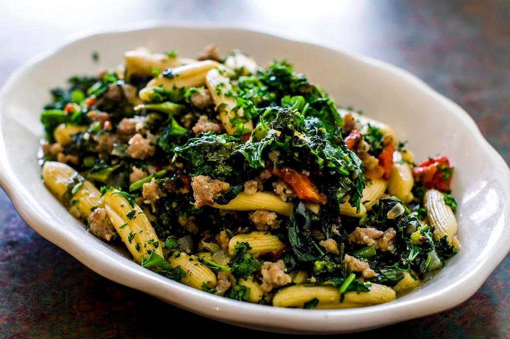 Cavatelli Rapini · Fresh short rolled pasta with sauteed broccoli rabe, roasted red peppers and sausage in a white wine garlic and olive oil sauce with hot red pepper flakes.