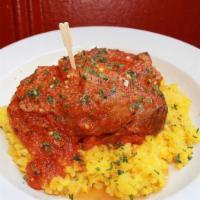 Osso Bucco · Braised veal shank in a light tomato with saffron risotto