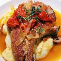 Berkshire Pork Chop · With hot and sweet vinegar peppers served w. mashed potatoes.