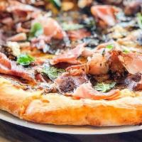 The Fig and Pig · Fig jam, mozzarella, parmesan, goat cheese and prosciutto; finished with balsamic vinegar, g...