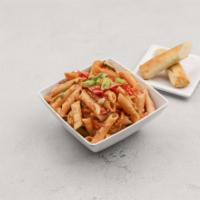 Spicy Cajun · Penne pasta tossed with our rustic tomato cream sauce, scallions, fresh yellow onions and re...