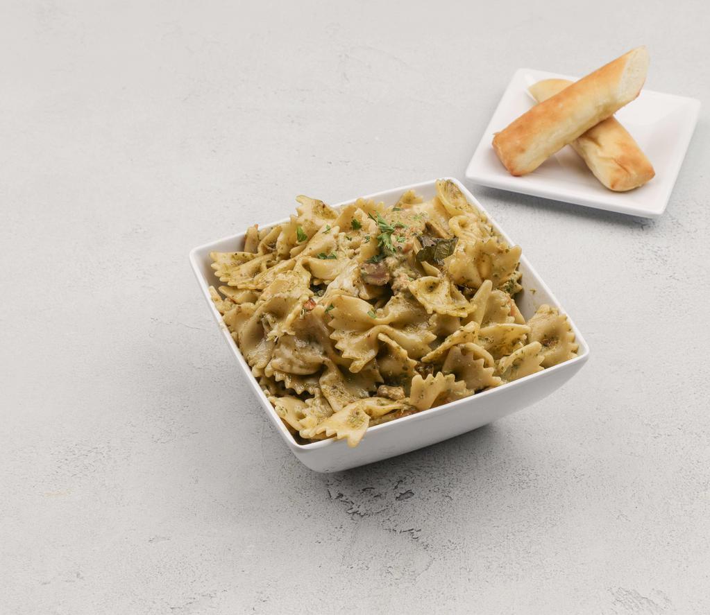 Basil Pesto · Farfalle pasta tossed with fresh mushrooms, tomatoes and our original basil pesto cream sauce. Garnished with fresh basil and grated Parmesan and Romano cheeses. (Sauce contains walnuts.)