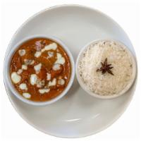 Butter Chicken · Chicken breast cooked with creamy tomato sauce and spices, served with a side of aromatic ba...