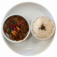Karaikudi Chicken Curry · 
Chicken is marinated in spices and slow-cooked in Chettinad style and served with a side of...