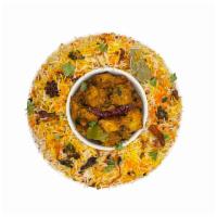 555 - Vegetarian Biryani · Baby Corn, Gobi, Paneer are marinated with spices and rich almond and cashew sauce, then pan...