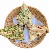 Plain Naan · Naan is a soft Indian-style flatbread traditionally made in the clay oven, and best enjoyed ...