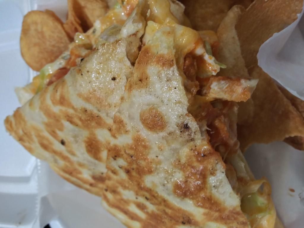 Chicken Philly Dilla  · Grilled, seasoned chicken , sauteed peppers, onions, mushrooms, bacon, and mozzarella cheese on grilled tortilla 