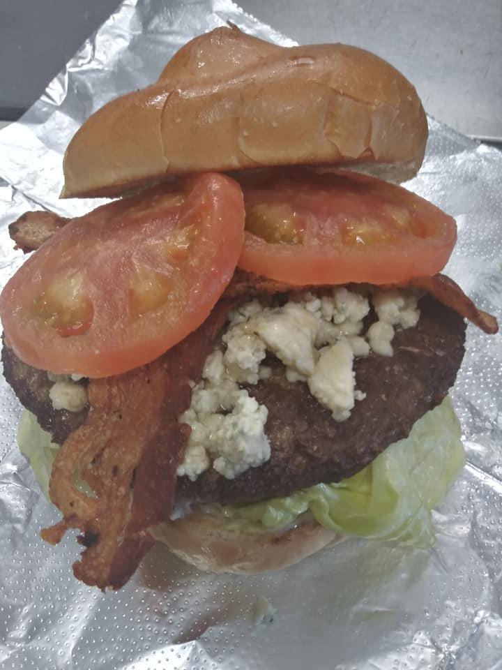 Bluesy Burger · 1/3 burger lb. patty, crumbly blue cheese, bacon, lettuce, tomato on a hard roll 