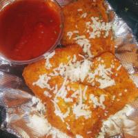 Fried Ravioli · Breaded, fried cheese filled ravioli served with warm marinara sauce for dipping - 6 per ord...