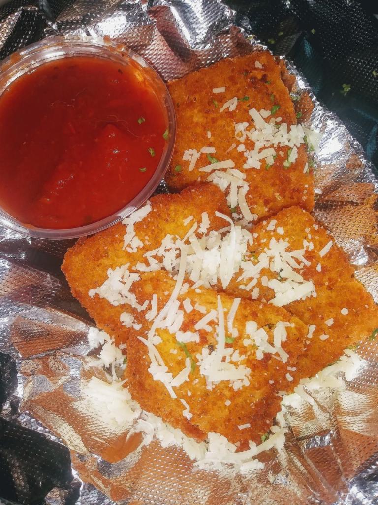 Fried Ravioli · Breaded, fried cheese filled ravioli served with warm marinara sauce for dipping - 6 per order 