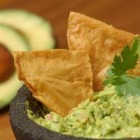 Guacamole & Chips · Our famous avocado dip prepared fresh to order with onions, tomatoes, cilantro and lime.