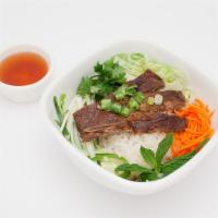 Grilled Pork Chop Rice Bowl · Grilled pork chop on white rice bowl, comes with lettuce, tomato, cucumber, cilantro, jalape...