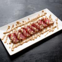 Black Pepper Tuna · Seared sashimi tuna coated with black pepper, served with mustard sauce.Packed separately wi...