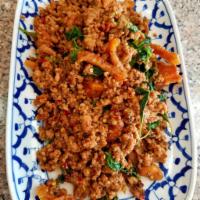 26. Pad Ka Prow · Stir-fried your choice of ground meat or sliced meat with fresh holy basil leaves, chili and...