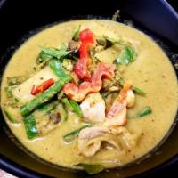 84. Green Curry · Aromatic green Thai curry paste with your choice of meat, bamboo shoots, eggplant, green bea...