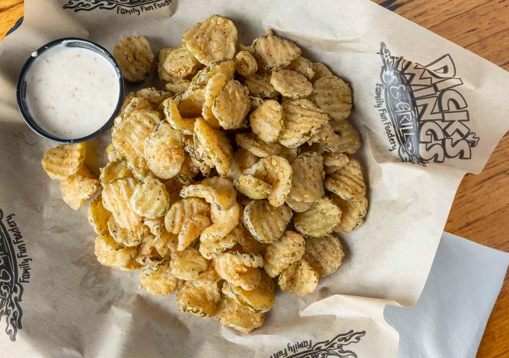 Fried Pickles · Sliced crinkle cut pickle chips, lightly breaded and fried golden-brown. Served with Cajun ranch dressing.