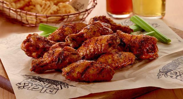 Victory Lane Wings · DWG's signature wings. Traditional bone-in wings, fried golden crisp, then tossed in a secret blend of our Victory Lane sauce and seasoning and charred to perfection on the grill. Fan favorite.