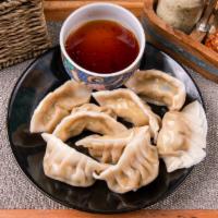 9. Dumplings · 8 pieces. Fried or steamed filled dough.
