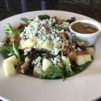 Apple Gorgonzola Salad · Spicy walnuts, Fuji apple, crumbled Gorgonzola with baby greens and our balsamic vinaigrette