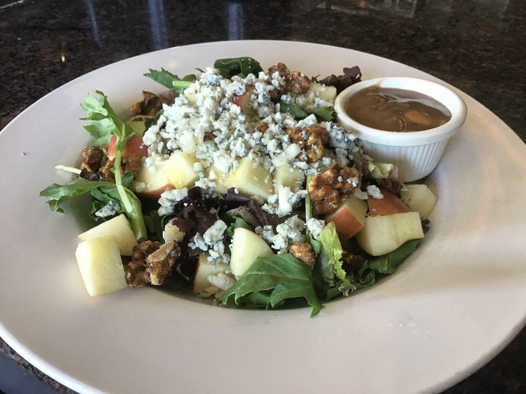 Apple Gorgonzola Salad · Spicy walnuts, Fuji apple, crumbled Gorgonzola with baby greens and our balsamic vinaigrette