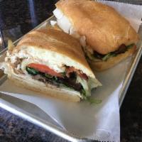 Napa Chicken Sandwich · Sliced grilled chicken breast, bacon and caramelized balsamic onions with melted Swiss chees...