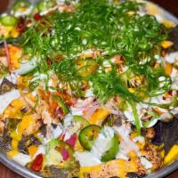 Buffalo Chicken Nachos · Pulled Chicken, Cherrywood-Smoked Cheddar, Red Onion, Roasted Tomatoes, Jalapeno, Ranch, Sca...
