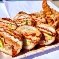 Double Crunch Roll · Inside: two shrimp tempura, avocado, imitation crab. 
Outside:  EEL Sauce, Spicy Mayo