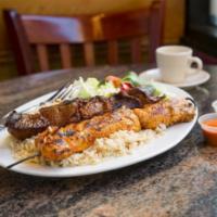 Combo Kabob · Your choice of two lamb, chicken, beef, or kafta. Served with rice pilaf and Greek salad.