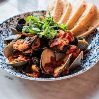 Steamed Clams & Mussels · Tomatoes, Saffron, White Wine, Seaweed & Roasted Garlic Butter, Grilled Bread (NF)