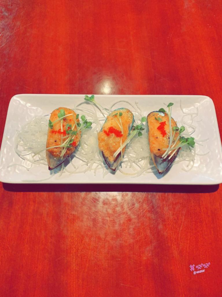 A1. Grilled Mussels · 3 pieces. Grilled mussels with spicy mayo and tobiko on top.