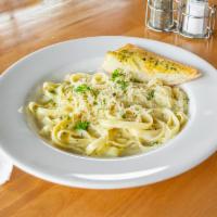 Fettuccine Alfredo · Fettuccine noodles smothered in our own creamy Alfredo sauce. Vegetarian.