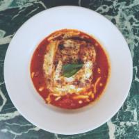 Beef Lasagna · Flat sheet pasta layered with slow-cooked meat sauce, creamy bechamel, Parmigiano and whole ...