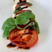 Lunch Caprese Salad · Mozzarella, tomatoes, and basil salad.