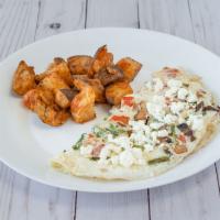 The Veggie Omelette · Our egg white omelette filled with asparagus, onions, tomatoes, mushrooms, and feta.