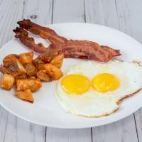 The Classic American · Two eggs any style, choice of meat (bacon, ham or sausage), and breakfast potatoes. Served w...