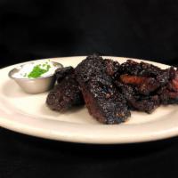 Burnt Ends · Decadent beef brisket fat cap, smoked a minimum of 12 hours, glazed with BBQ, and served wit...