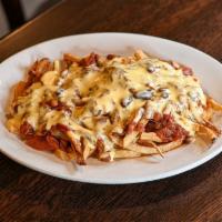 Loaded Fries · French fries, house chili, cheese sauce