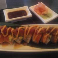Raw Fami-Le Roll · Shrimp tempura and cucumber topped with salmon, avocado, tuna chunks, eel sauce and spicy ma...
