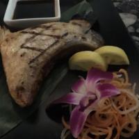 Hamachi Kama · Grilled yellowtail cheek served with teriyaki sauce.
