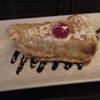 Fried Cheesecake · New York cheesecake Tempura-fried in vanilla batter and smothered in caramel and chocolate s...
