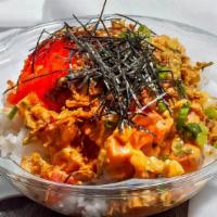 Hawaiian · Wild caught ahi tuna, sweet onions and cilantro tossed in spicy mayo. Topped with masago, gr...