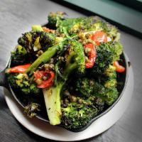 Charred Broccoli · Grilled scallions, peppadew peppers, and fried capers. Gluten free.