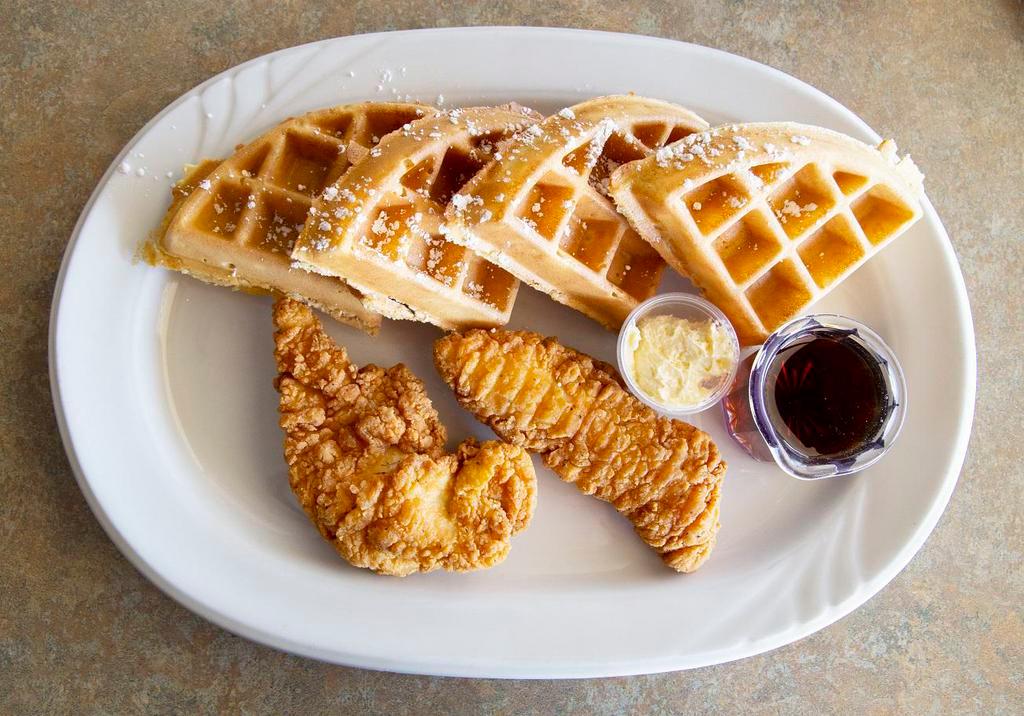 Chicken ＆ Waffles · One whole malted waffle with two breaded chicken tenderloins topped with powdered sugar