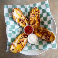 Potato Boats · Crispy baked potato skins stuffed with melted cheddar, Monterey jack cheese and real bacon p...