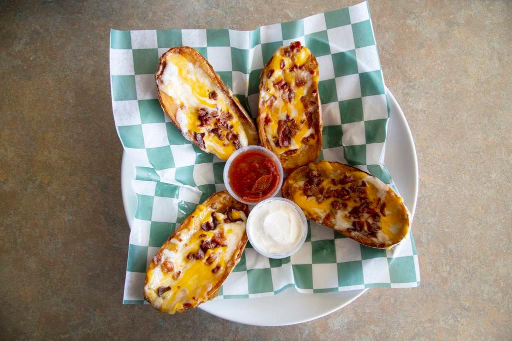 Potato Boats · Crispy baked potato skins stuffed with melted cheddar, Monterey jack cheese and real bacon pieces. Served with sour cream and our house made sals.