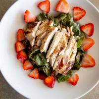 Spinach Salad · A pile of fresh spinach, tomato, egg, bacon, topped with bleu cheese crumbles and fresh stra...