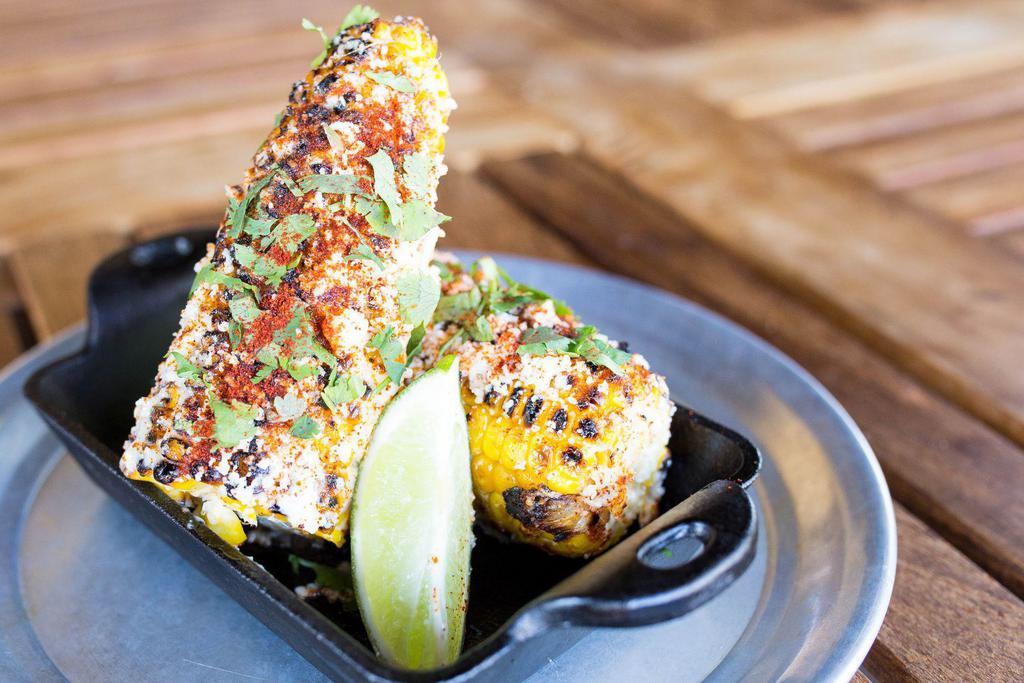 Grilled Mexican Corn Off the Cob · Basted in seasoning. Cotija cheese, cilantro, garlic mayo & fresh lime.