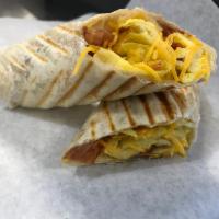 Breakfast Burrito · Scrambled eggs, Cheddar cheese, Potatoes, Bacon,  flour Tortilla.  
